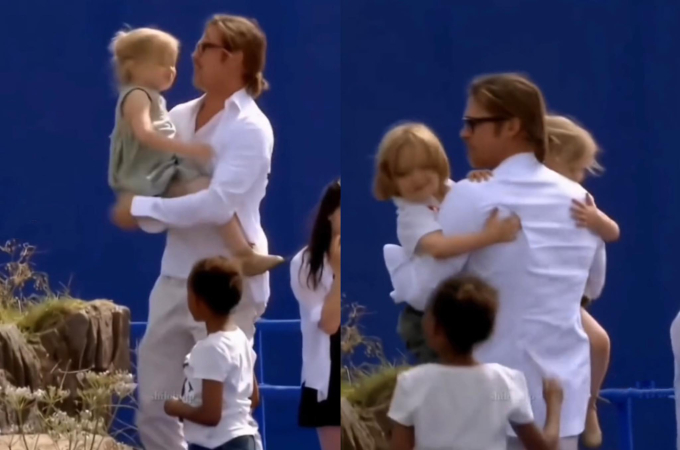 Brad Pitt đang mải ôm cặp sinh đôi (Ảnh cắt từ clip)