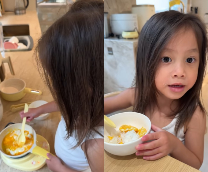 Lisa tự rán trứng ăn cơm