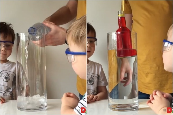 Đổ nước vào chai to hơn và thả chai nhỏ có chứa phẩm màu vào. Nguồn: thedadlab.com