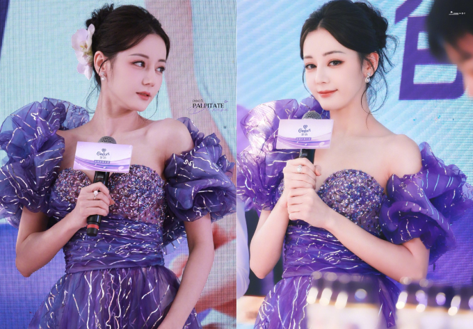 Người đẹp xuất hiện lộng lẫy, ngọt ngào như 1 nàng công chúa trong mẫu đầm tím bồng bềnh, điệu đà. Mỹ nhân Tân Cương lựa chọn kiểu tóc búi, cài hoa 1 bên kết hợp với lớp make-up tone cam nhẹ nhàng để diện mạo thêm phần nữ tính, yêu kiều. Visual của Nhiệt Ba tại sự kiện này vào thẳng top 10 hot search Weibo. Trên mạng xã hội, nữ diễn viên được netizen khen đẹp như công chúa xé truyện bước ra