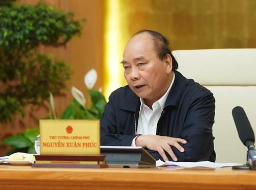Thủ tướng Nguyễn Xuân Phúc tại cuộc họp vào chiều 20/3. Ảnh: VGP/Quang Hiếu