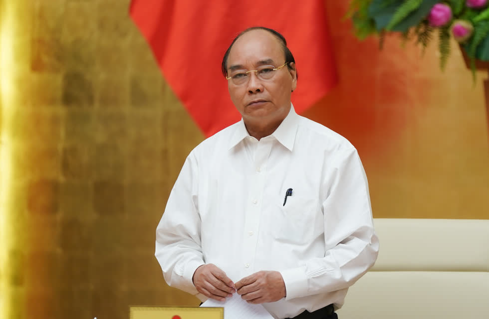 Thủ tướng Nguyễn Xuân Phúc chủ trì cuộc họp Thường trực Chính phủ nghe Ban chỉ đạo Quốc gia về phòng chống COVID-19 sáng 25/7. Ảnh VGP