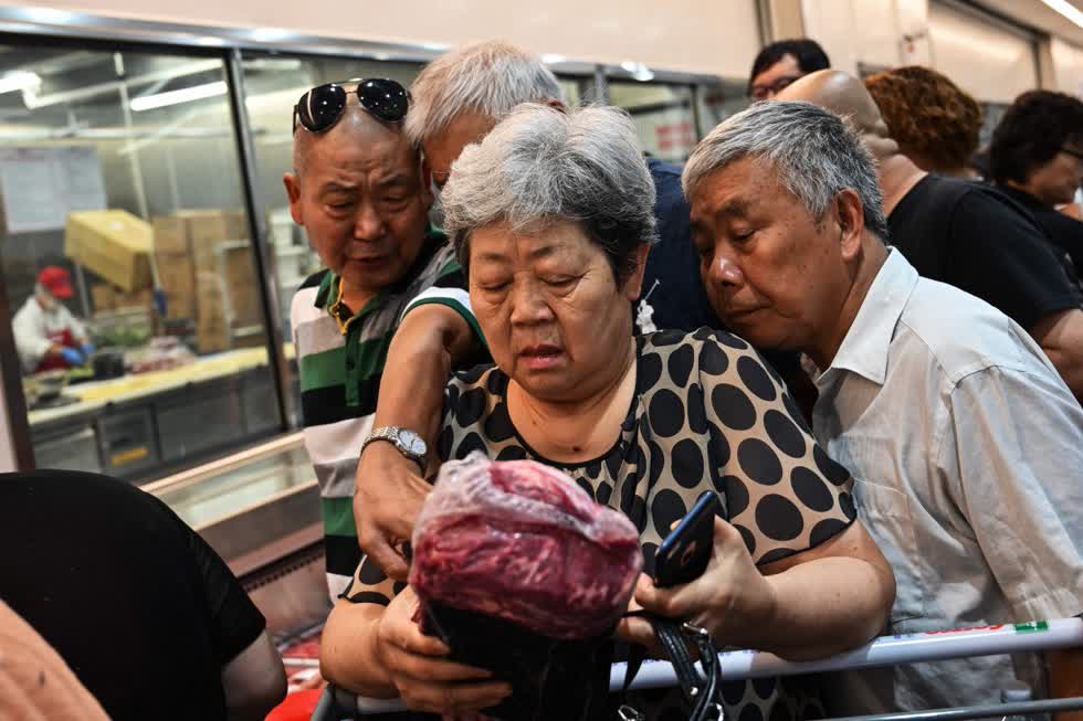 Dân Trung Quốc có thể sẽ đón một cái  Tết  với giá thịt heo cao ngất ngưởng như năm ngoái. Ảnh: Nestia