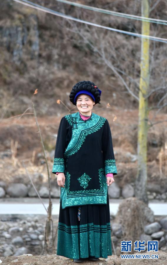 Ba Mộc Ngọc Bố Mộc trong trang phục truyền thống dân tộc Di. Ảnh: Xinhuanet