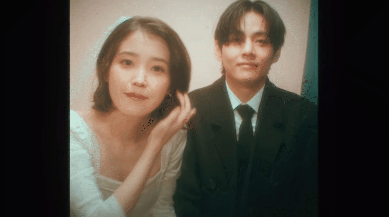 IU nắm chặt tay V không rời, còn làm hẳn đám cưới ngọt ngào với nam thần BTS trong MV mới!