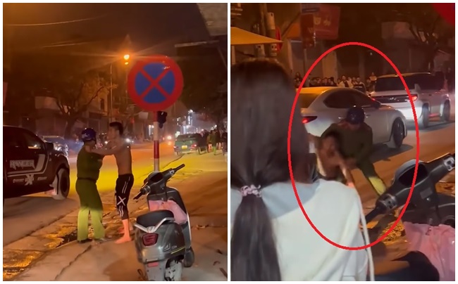 Lực lượng chức năng không chế đối tượng cầm dao đe dọa người đi đường. (Ảnh cắt từ clip)