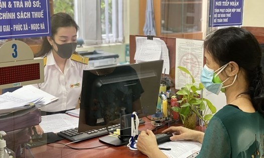 Từ 1/3/2026, tài khoản ngân hàng hộ kinh doanh bắt buộc phải đúng tên đăng ký (Ảnh: Lao động).