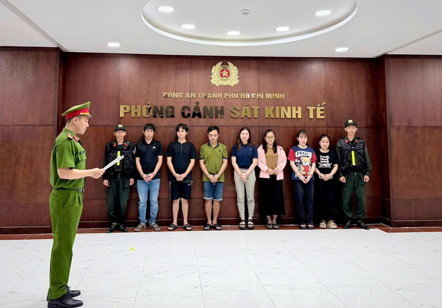 Các bị can tại cơ quan công an - Ảnh: Bộ Công an