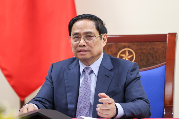   Thủ tướng Phạm Minh Chính điện đàm với giám đốc điều hành Pfixer - Ảnh: CGV  