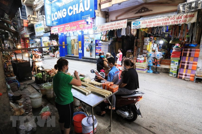 Cửa hàng bán đậu phụ trên địa bàn quận Thanh Xuân mở cửa trở lại để phục vụ khách như bình thường. (Ảnh: Tuấn Anh/TTXVN)