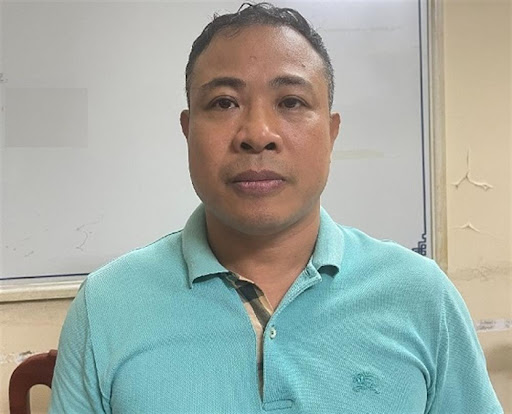 Nghiêm Quang Minh chủ khu chung cư mini bị cháy khi bị bắt. Ảnh: Bộ Công an