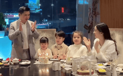 Trong tiệc sinh nhật chồng, Đỗ Mỹ Linh chọn góc giấu bụng, ngoại hình tròn trịa hơn 