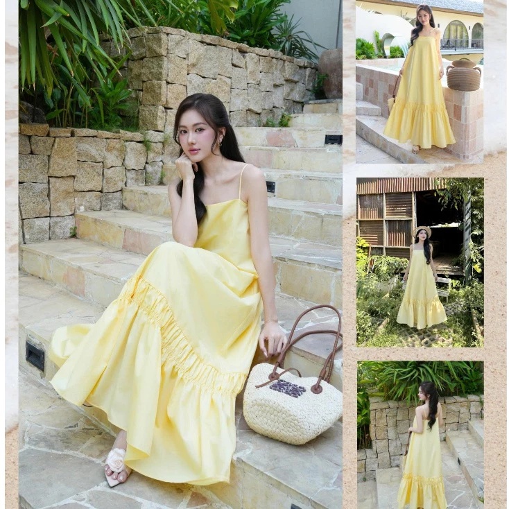 Gam vàng bơ ngọt ngào đang là một trong những màu sắc được nhiều tín đồ thời trang săn đón trong mùa hè năm nay. Chiếc váy maxi hai dây với phom suông rộng không chỉ mang đến cảm giác mát mẻ, dễ chịu mà còn khéo léo che khuyết điểm cơ thể, phù hợp với nhiều vóc dáng, kể cả mẹ bầu. Chỉ cần thêm một chiếc túi cói và sandal đơn giản là đã đủ tạo nên outfit vừa nổi bật, vừa đậm chất nghỉ dưỡng.