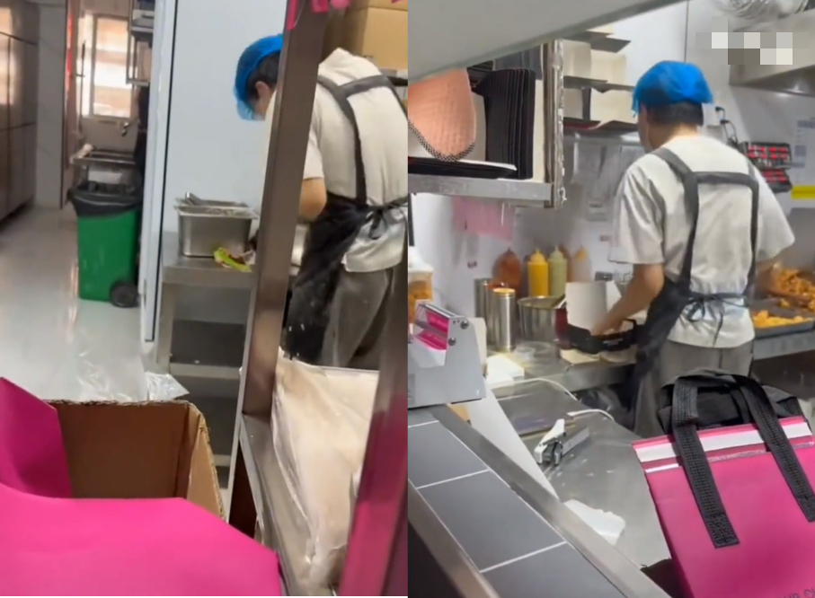 Nam thanh niên khoảng ngoài 20 tuổi, một mình tất bật trong ca làm tại quán gà rán (Ảnh cắt từ video) 