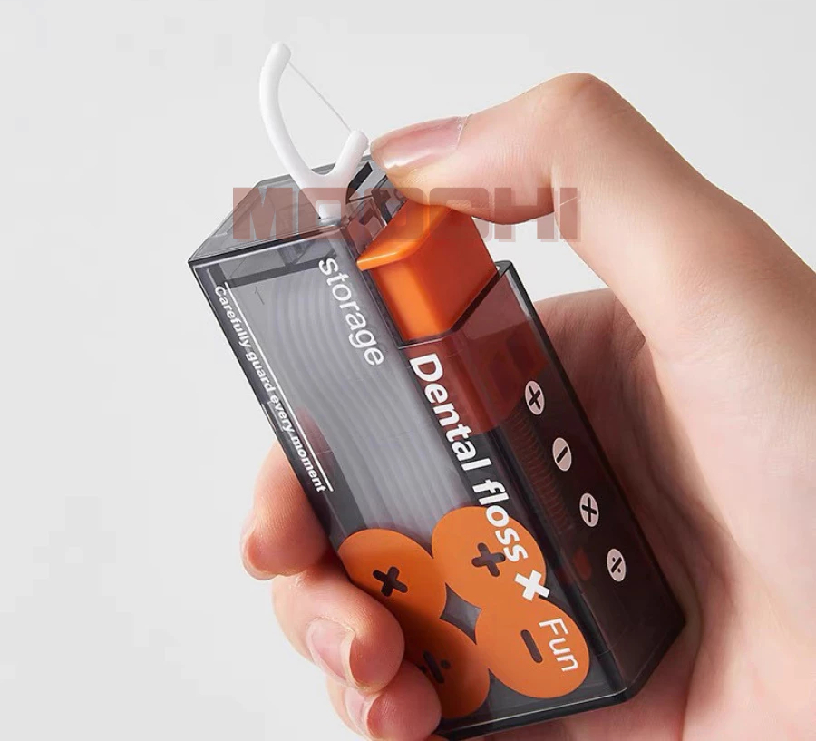 Hộp chỉ nha khoa có nút bấm tự động.