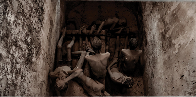 Hình ảnh người tù trong di tích chuồng cọp (Ảnh: internet).