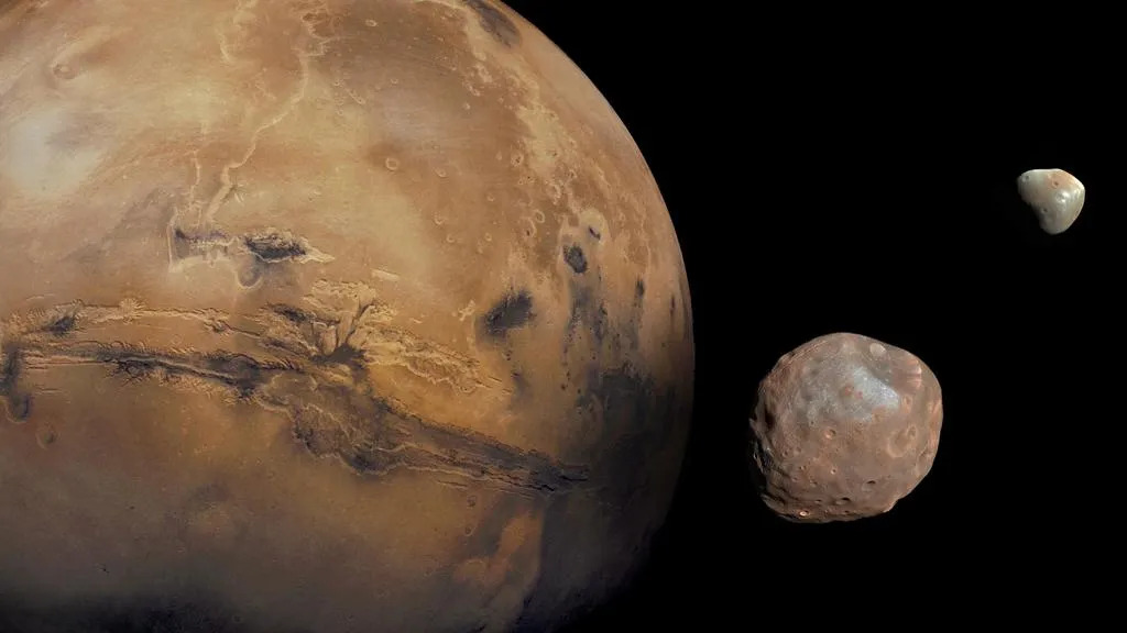 Bức ảnh ghép về sao Hỏa cùng hai mặt trăng Phobos và Deimos của hành tinh đỏ (Ảnh: NASA/JPL-Caltech/GSFC/Univ. of Arizona)