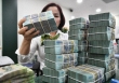 Dòng tiền đổ vào ngân hàng bất chấp lãi suất huy động liên tục giảm
