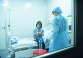 Miễn phí điều trị nhiễm virus corona cho những đối tượng nào?
