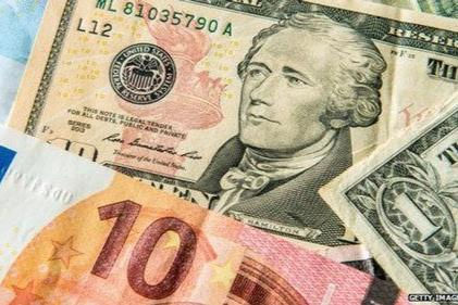 Đồng USD giảm nhẹ trước khi cuộc họp của FED kết thúc