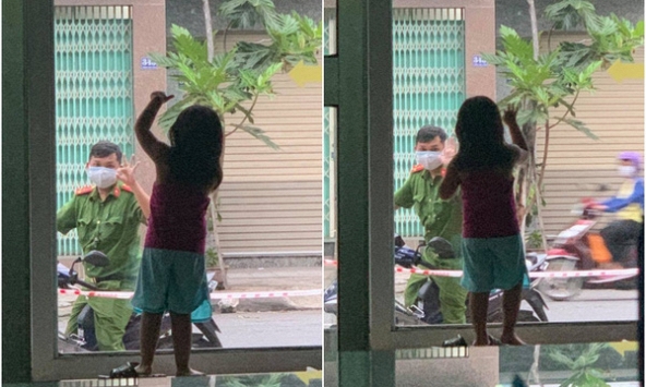 Xúc động với hình ảnh chiến sĩ công an Đà Nẵng chỉ dám chào con qua cửa kính