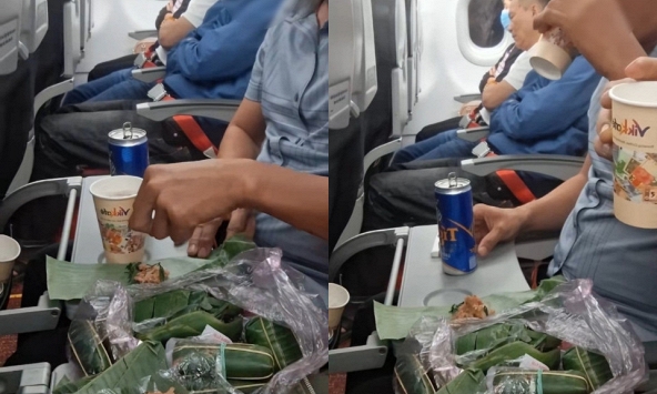 Mang cả túi nem chua, khui bia nhậu ngay trên máy bay, 2 người đàn ông gây tranh cãi dữ dội