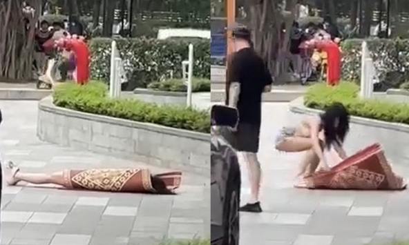 Clip hot girl có hành động khó hiểu, nằm đắp chiếu giữa sảnh chung cư đông người