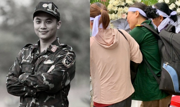Mẹ Thượng úy Lê Văn Thắng khoác quân phục, đeo ba lô con trai trong lễ đưa tang ở Nghệ An