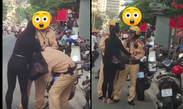 Giằng co với 2 CSGT giữa phố, giật tờ giấy xanh: Cô gái giải thích